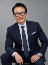 Sung Won, MD smiling in a navy suit